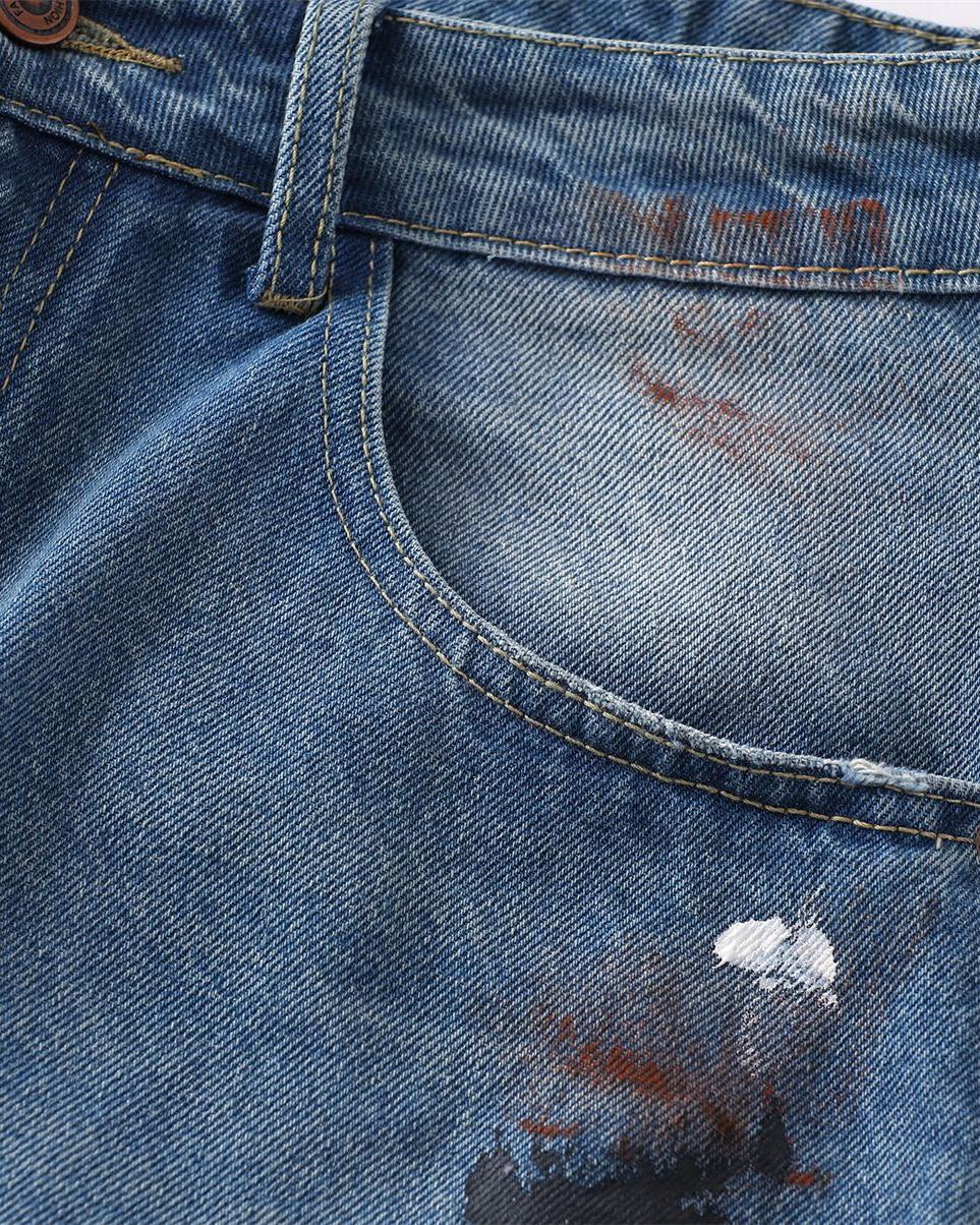 Distressed gradient jeans