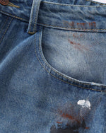 Distressed gradient jeans