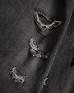 Ripped raw-edge denim shorts