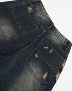 Washed distressed denim trousers