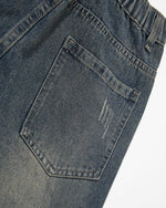 Distressed multi-pocket jeans