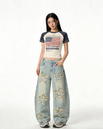 Distressed washed jeans