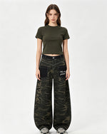 Distressed patchwork camouflage trousers