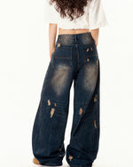 Washed distressed denim trousers