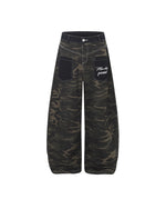 Distressed patchwork camouflage trousers