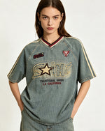 Distressed denim short-sleeved shirt with appliqué