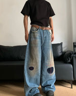 Distressed straight jeans