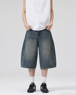 Paneled distressed cropped shorts