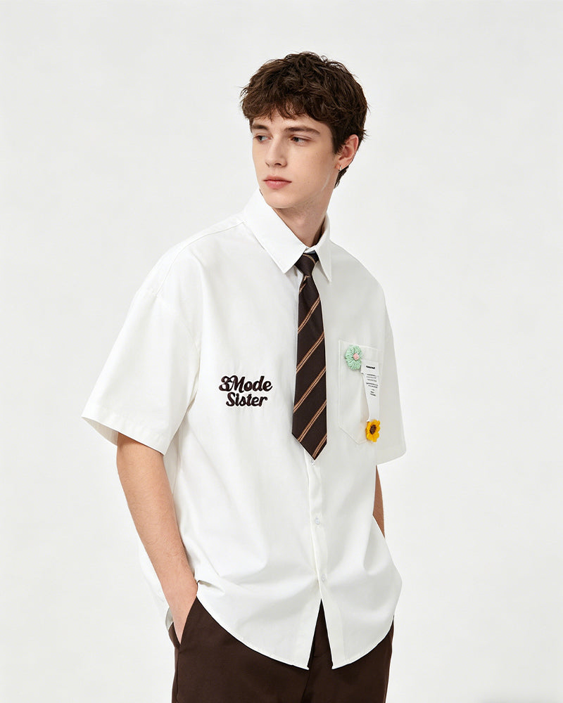 Short-sleeved shirt with small embroidered flowers