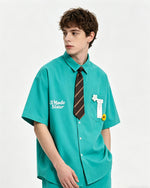 Short-sleeved shirt with small embroidered flowers