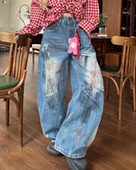 Distressed gradient jeans