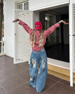 Distressed gradient jeans