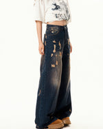 Washed distressed denim trousers