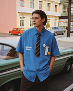 Short-sleeved shirt with small embroidered flowers