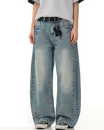 水洗彎刀牛仔褲