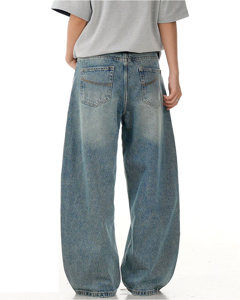 水洗彎刀牛仔褲