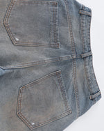 Distressed ripped denim trousers