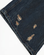 Washed distressed denim trousers