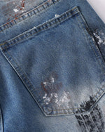 Distressed gradient jeans