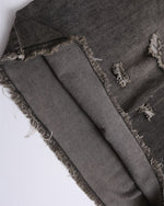 Ripped raw-edge denim shorts