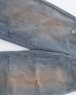 Distressed ripped denim trousers