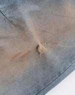 Distressed ripped denim trousers