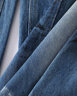 Distressed gradient jeans