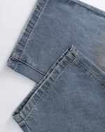 Distressed ripped denim trousers