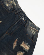 Washed distressed denim trousers