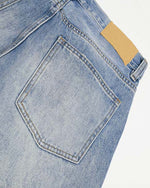 Distressed straight jeans