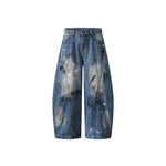 Distressed gradient jeans