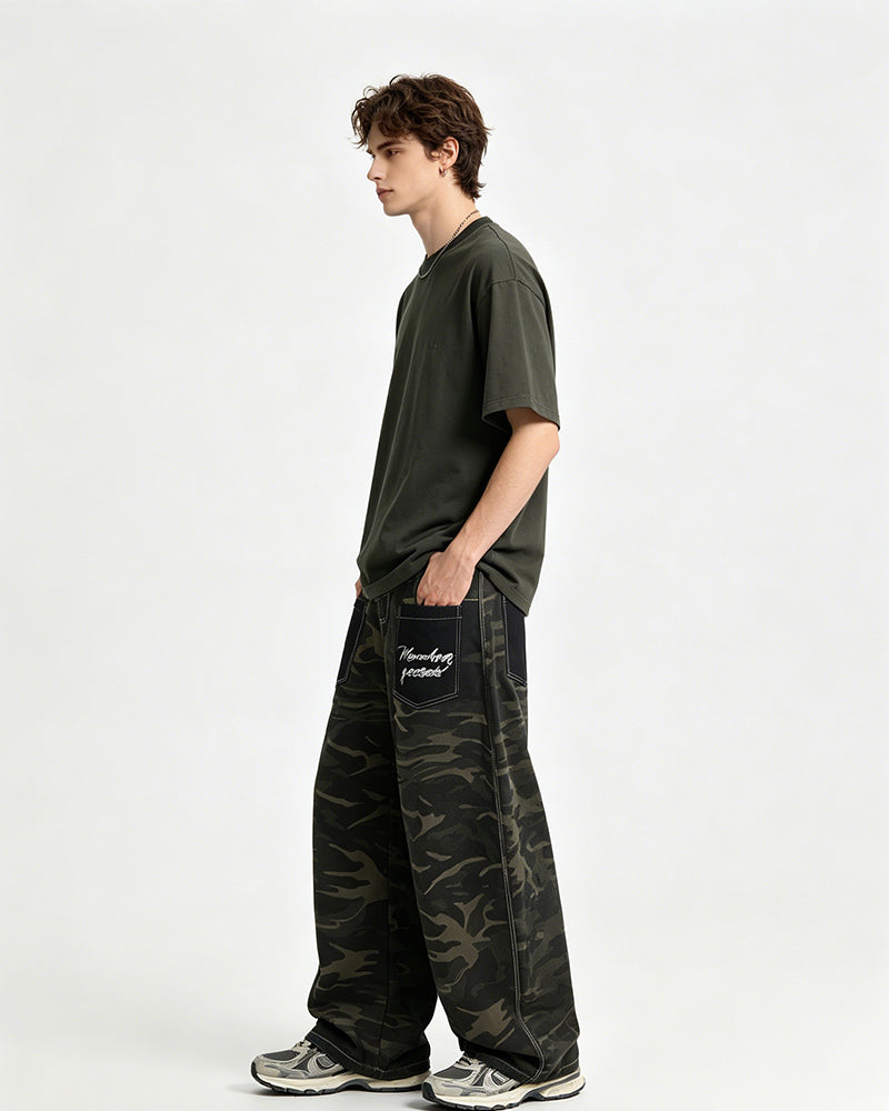 Distressed patchwork camouflage trousers