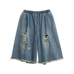 Ripped raw-edge denim shorts