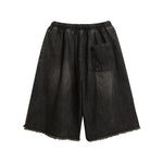 Ripped raw-edge denim shorts