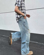 Distressed washed straight jeans