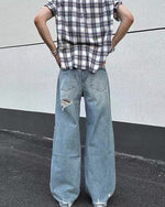 Distressed washed straight jeans