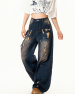 Washed distressed denim trousers