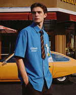 Short-sleeved shirt with small embroidered flowers