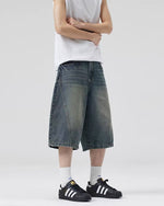 Paneled distressed cropped shorts