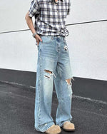 Distressed washed straight jeans