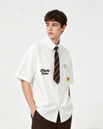 Short-sleeved shirt with small embroidered flowers