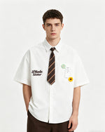 Short-sleeved shirt with small embroidered flowers