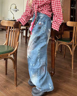 Distressed gradient jeans